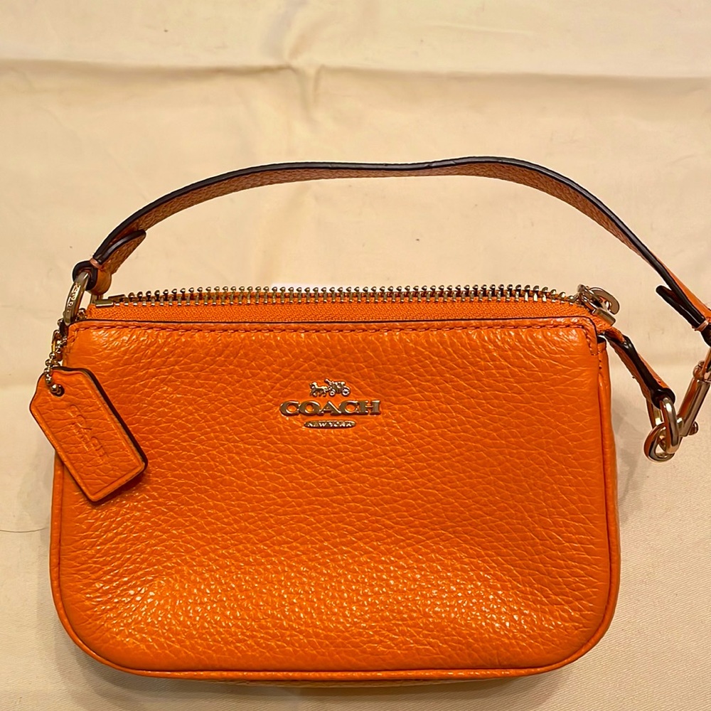 Coach tangerine wristlet